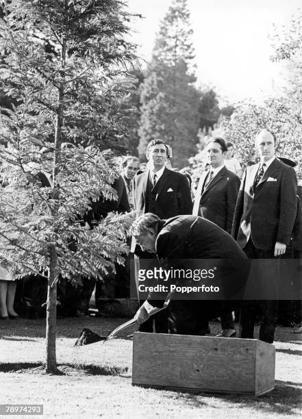 6th October 1971, Emperor Hirohito of Japan plants a tree of the species Cryptomeria Japonica at the beginning of his tour of the Royal Botanic...