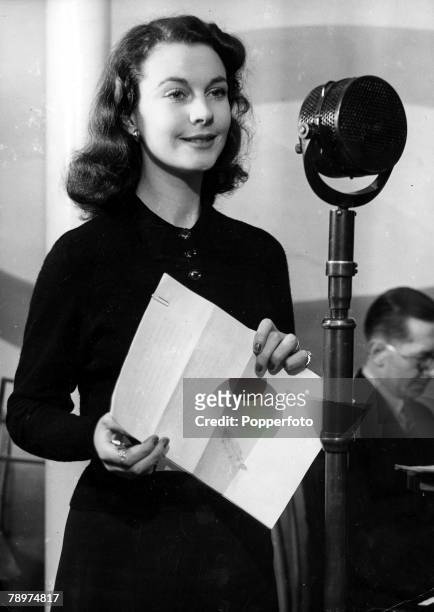 London, England, 2nd February Actress Vivien Leigh star of the film "Gone With The Wind" speaking into a microphone while broadcasting from Drury...