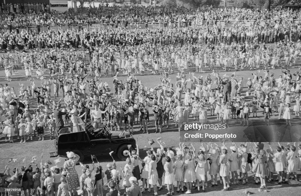 1954, Royal Tour of Australia, the picture shows Queen Elizabeth and the Duke of Edinburgh in a Land Rover as they drove through lanes of children at Bendigo, where 16,000 children assembled to greet them.