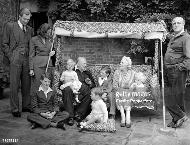 Circa 1951, The Churchill family on the Pink Terrace at Chartwell, Reading from left to right : Duncan and Diana Sandys, Julian Sandys, Emma Soames,...