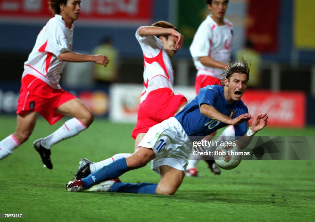 Football. 2002 FIFA World Cup Finals. Second Phase. Daejeon, South Korea. 18th June 2002. South Korea 2 v Italy 1 (after extra time, on golden goal). Italy's Francesco Totti falls in the penalty area under challenge from South Korea's Chong Gug Song, only