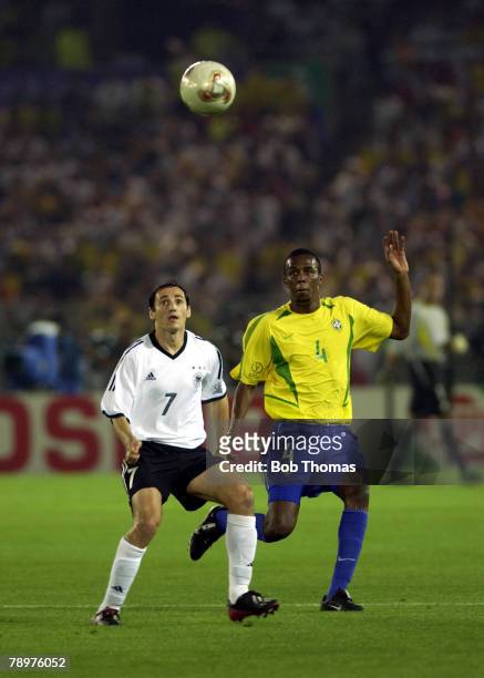Football, 2002 FIFA World Cup Final, Yokohama, Japan, 30th June 2002, Germany 0 v Brazil 2, Brazil's Roque Junior with Germany's Oliver Neuville...