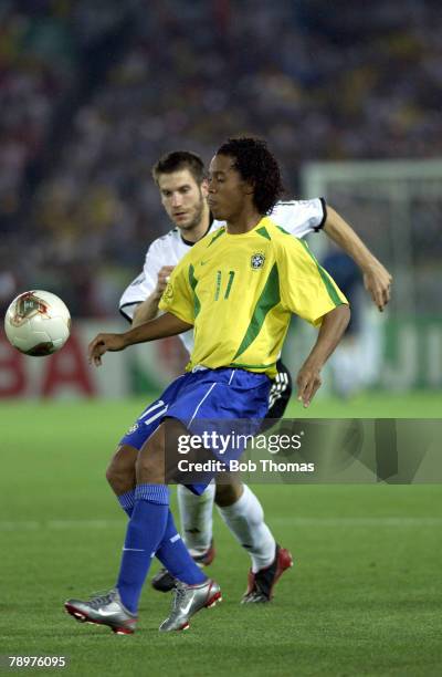 Football, 2002 FIFA World Cup Final, Yokohama, Japan, 30th June 2002, Germany 0 v Brazil 2, Ronaldinho of Brazil watched by Germany's Torsten Frings