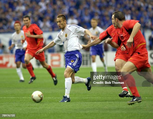 Football, 2002 FIFA World Cup Finals, Saitama, Japan, 4th June 2002, Japan 2 v Belgium 2, Japan's Hidetoshi Nakata passes the challenge of Belgium's...