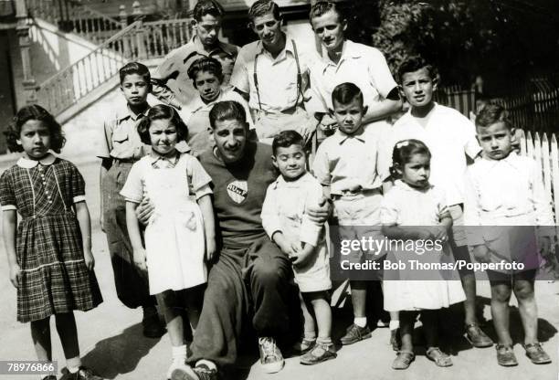Sport, Football, circa 1950, Uruguayan football hero Alcides Edgardo Ghiggia poses for the camera with a group of fans in Montevideo, Alcides Edgardo...