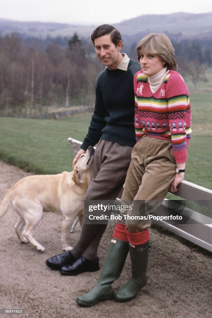 British Royalty. Balmoral, Scotland. 6th May 1981. Prince Charles and his fiancee Lady Diana Spencer together with their dog Harvey rest by a bench.