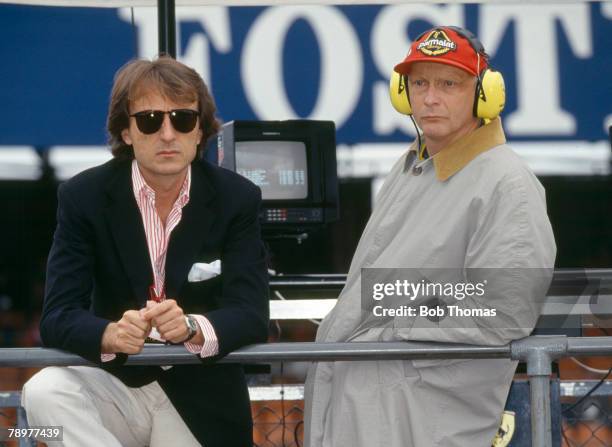 Austrian world champion racing driver Niki Lauda pictured on right with Chairman of Ferrari Luca Cordero di Montezemolo as they attend the 1992...