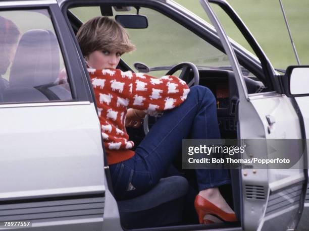 Lady Diana Spencer sits in her car during a polo match at Smiths Lawn, Windsor, England, June 1981. She is wearing a 'Black sheep' wool jumper by...