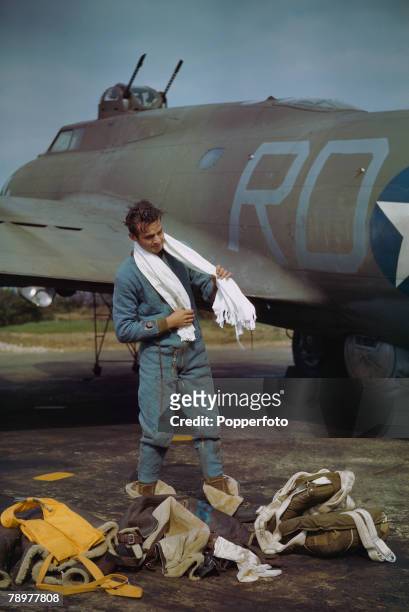 World War II, May 1943, Staff Sgt, F,T, Lusic, air gunner of B-17 Flying Fortresses dresses for a mission