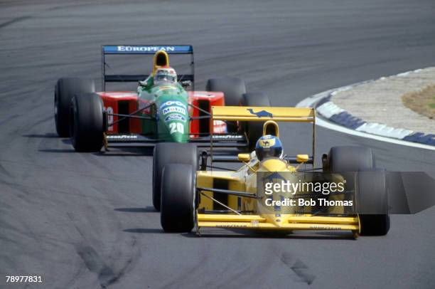 British racing driver Derek Warwick drives the Camel Team Lotus Lotus 102 Lamborghini 3512 3.5 v12 ahead of Brazilian racing driver Nelson Piquet in...