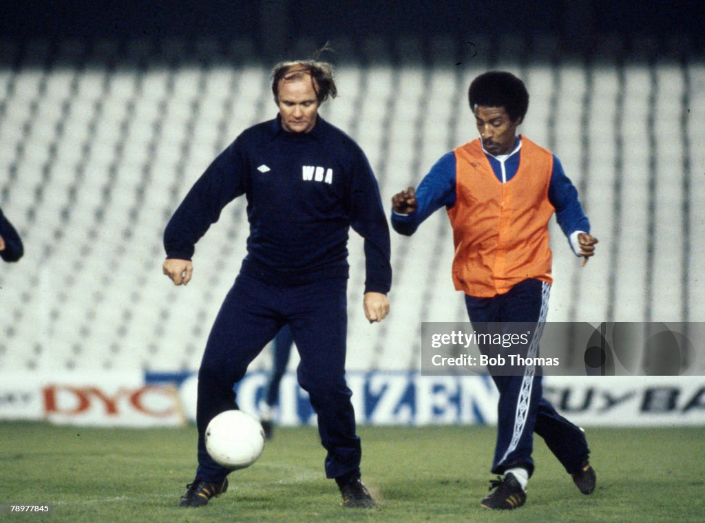 Sport. Football. pic: circa 1980. West Bromwich Albion Training in Madrid. West Bromwich Albion Manager Ron Atkinson is challenged by defender Brendan Batson.