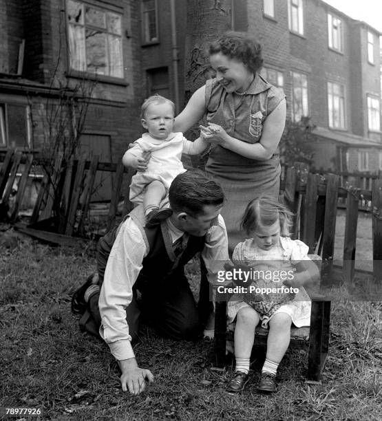 Football Bolton International centre-half, Malcolm Barrass, born in BLackpool, with his wife Joyce, daughter Lynn and son Robert