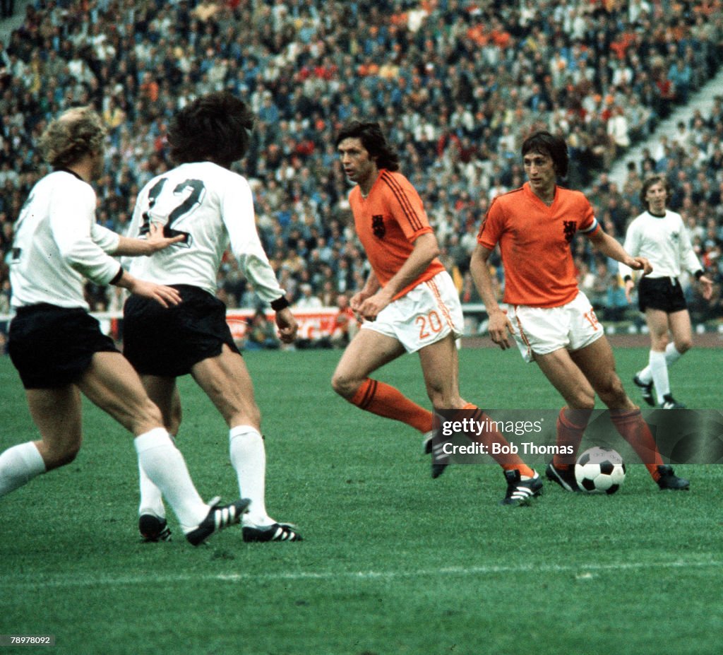 Football. 1974 World Cup Final. Olympic Stadium, Munich, Germany. 7th July 1974. West Germany 2 v Holland 1. Holland's Johan Cruyff on the ball with Suurbier (20) supporting.