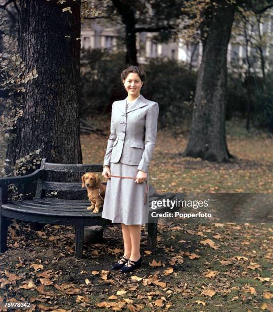 World War II, September 1942, A portrait of Princess Alexandra of Greece in a park with her corgi dog. She later became Queen Alexandra Of Yugoslavia.