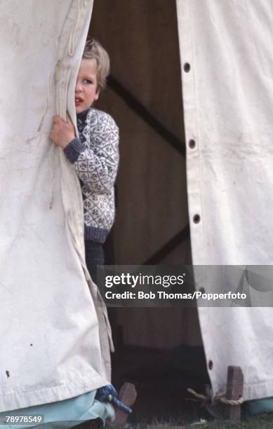 British Royalty, Badminton Horse Trials, England Master Peter Phillips, son of Princess Anne and Captain Mark Phillips, peeps through the opening of...