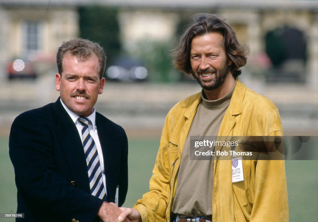 Sport. Cricket. Charity Match in Northamptonshire. pic: August 1989. Rock star Eric Clapton, right meets Northamptonshire cricketer Richard Williams before the charity cricket match before Clapton's XI played Northants.
