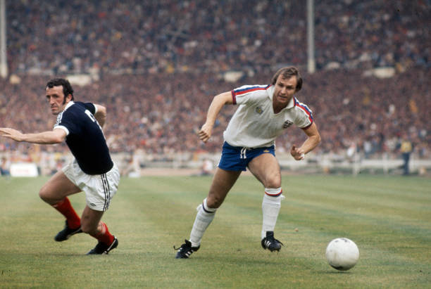 4th June 1977, British Championship at Wembley, England 1 v Scotland 2, England's Dennis Tueart, right, moves past Scotland defender Danny McGrain