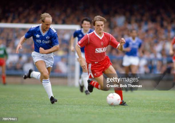 Circa 1983, Nottingham Forest's Steve Wigley is challenged for the ball by Leicester City's Ian Wilson