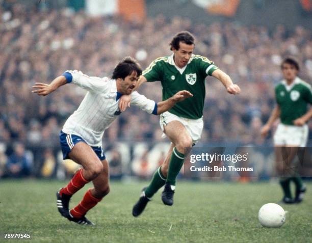 14th October 1981, World Cup Qualifier in Dublin, Republic of Ireland 3 v France 2, Republic of Ireland's Liam Brady moves past France's Rene Girard