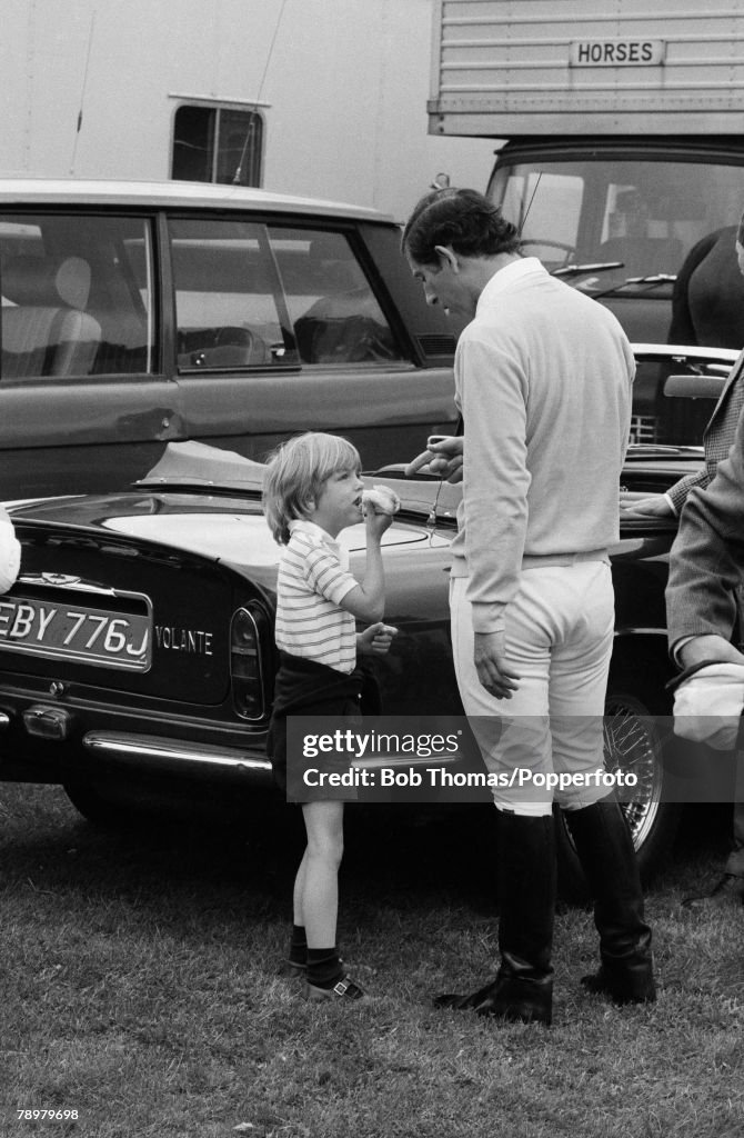 British Royalty. Ascot, England. Charity Showjumping Event. May 1981. Prince Charles talks to a young Tom Parker Bowles, son of Camilla Parker Bowls and his godson.