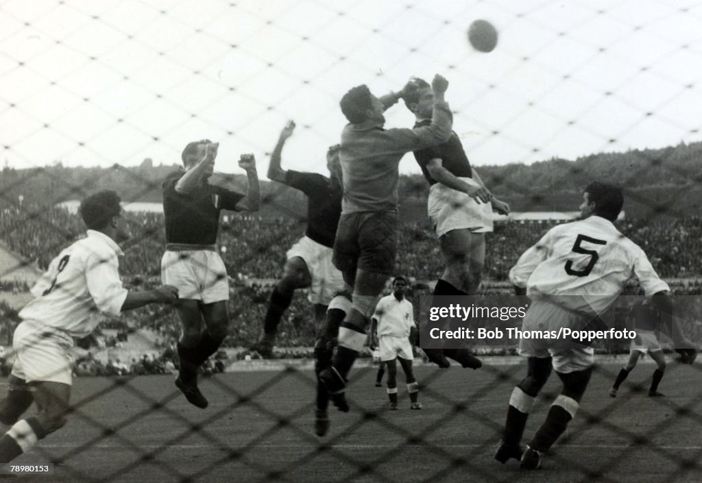 Sport. Football. pic: 3rd May 1949. Lisbon. Friendly. Benfica v Torino. The Benfica goalkeeper Machado punches the ball away under pressure from Torino's Menti, Bongiorni and Mazzola. Tragically the entire Torino team was killed the following day when the
