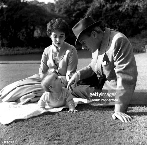 Film stars, Michael Wilding and his wife, Elizabeth Taylor with their son, Michael Howard