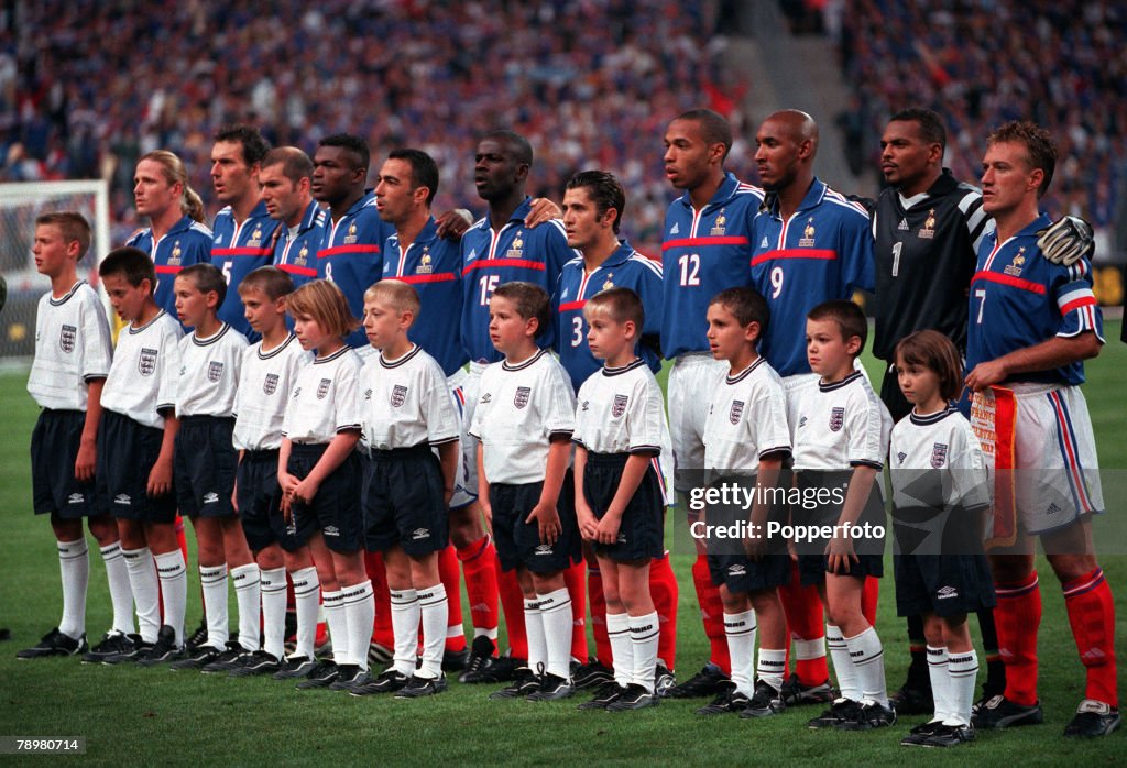 Football. Friendly International. Stade de France, Paris, France. 2nd September 2000. France 1 v England 1. The World and European Championship winning French team line-up for the National Anthems. L-R: Emmanuel Petit, Laurent Blanc, Zinedine Zidane, Marc