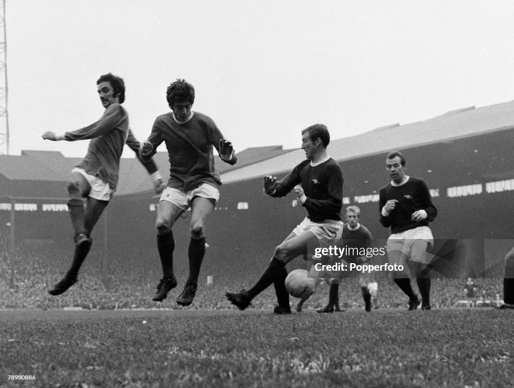 Football. English League Division 1. Old Trafford. Circa 1972. Manchester United v Arsenal. Manchester United's George Best and Willie Morgan causing problems for Arsenal Bob McNab.