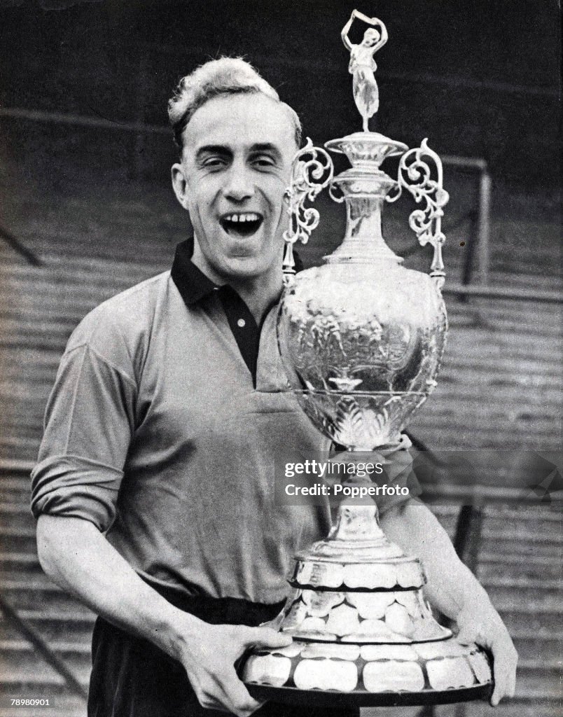 Football. 1954. Wolverhampton Wanderers and England footballer Billy Wright is pictured with the League Division 1 Championship Trophy which Wolves won in season 1953-4.