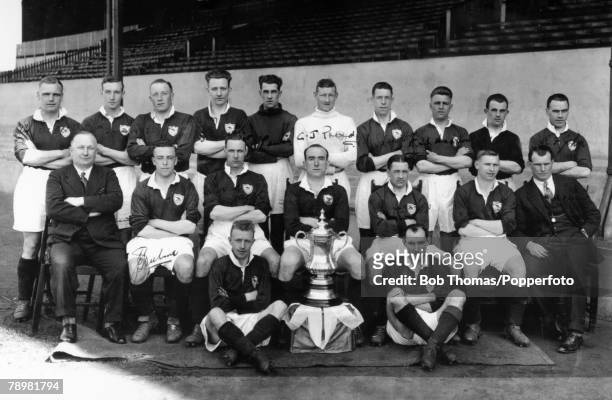 Arsenal F,C, pictured with the FA, Cup after their 2-0 victory over Huddersfield Town at Wembley, Back row, left-right, Alf Baker, Alf Haynes, Jack...
