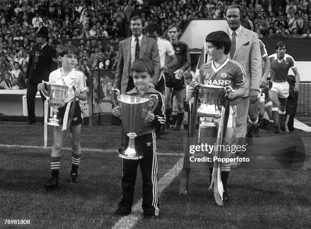 17th August 1983, Martin Buchan Testimonial Match, The Managers Alex Ferguson, Aberdeen, and Ron Atkinson, Manchester United follow the mascots who...