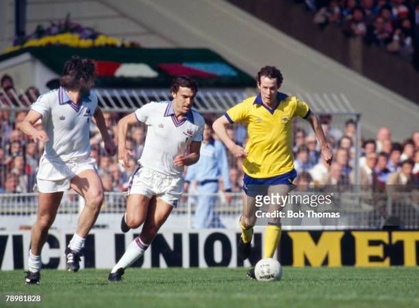 10th May 1980, FA, Cup Final at Wembley, West Ham United 1 v Arsenal 0, Arsenal's Liam Brady is challenged by West Ham pair Trevor Brooking, centre...
