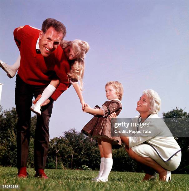 Picture of British entertainer Bruce Forsyth and his wife Penny and children