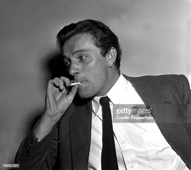 Portrait of Welsh film star Richard Burton smoking a cigarette
