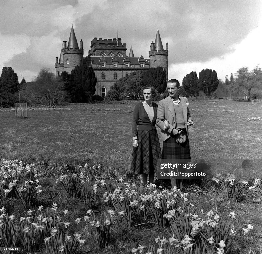 1953. The Duke and Duchess of Argyll stroll around the grounds of Inveraray Castle, now to be opened to the public.