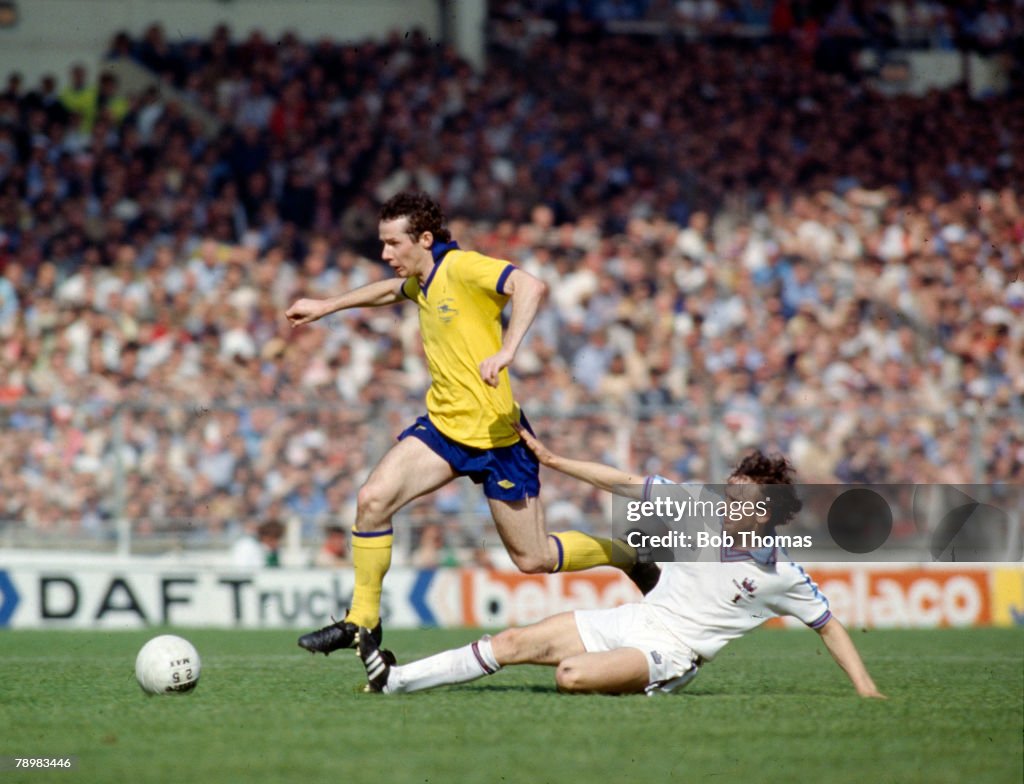 BT Sport. Football. FA Cup Final Replay at Wembley. pic: 10th May 1980. West Ham United 1 v Arsenal 0. Arsenal's Liam Brady is tackled by West Ham United's Paul Allen, right.