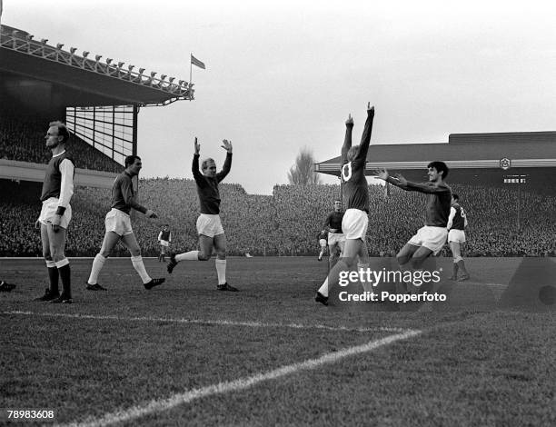 December 1964, Division 1, Arsenal v Manchester United at Highbury, Manchester United's Denis Law celebrates his goal with George Best, right and...