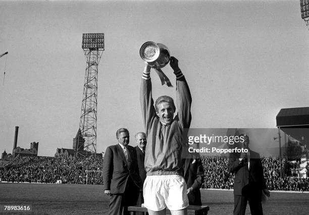 19th May 1965, Inter-Cities Fairs Cup, Quarter Final, Manchester United v Racing Strasbourg Manchester United's Denis Law raises the League...