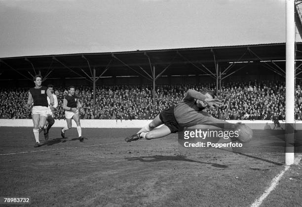 7th March 1964, Division 1, West Ham United 0, v Manchester United 2, at Upton Park, West Ham United goalkeeper Jim Standen dives in vain as...