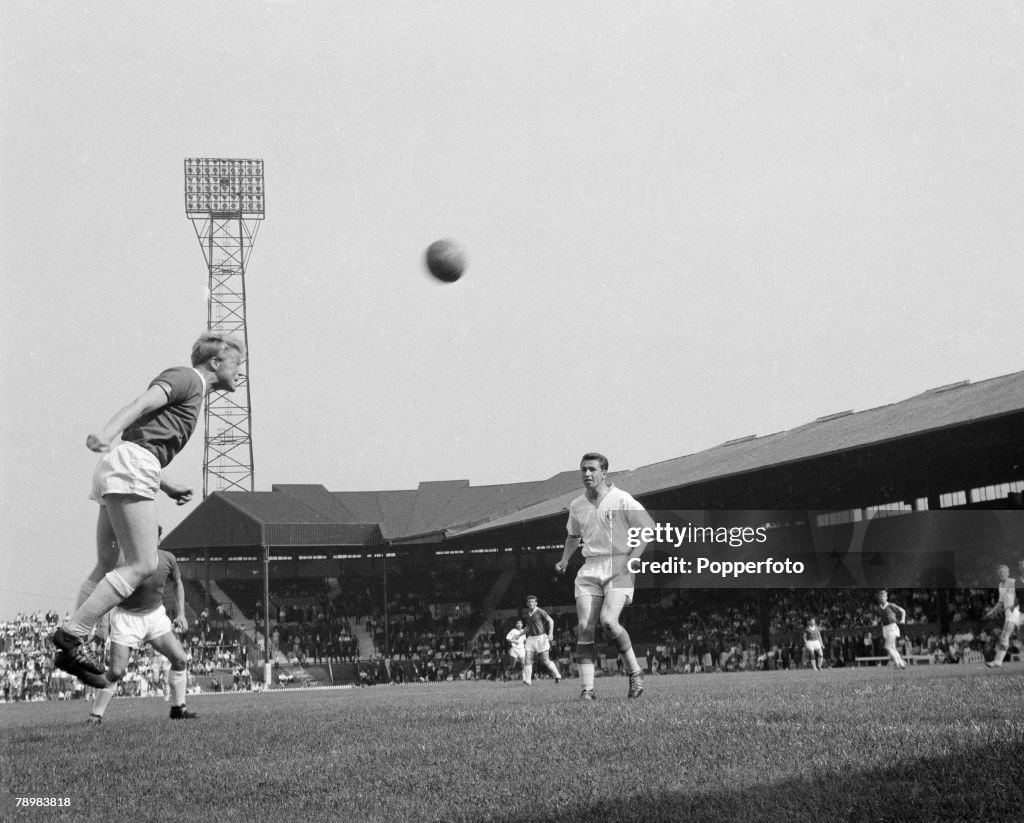 Football. English League. Circa 1962. Albert Quixhall of Manchester United heads the ball.