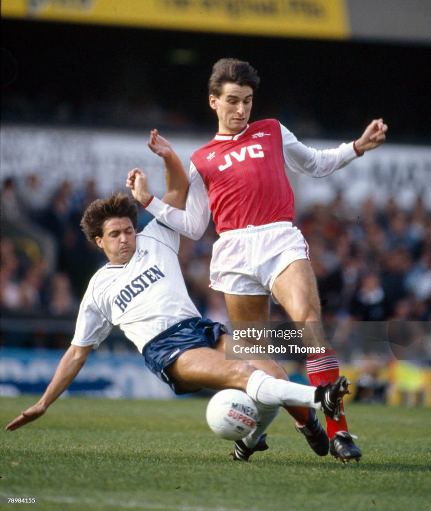 Sport. Football. pic: October 1986. Division 1. Tottenham Hotspur 1 v Arsenal 2. Tottenham Hotspur defender Gary Mabbutt slides in to tackle Arsenal striker Alan Smith.