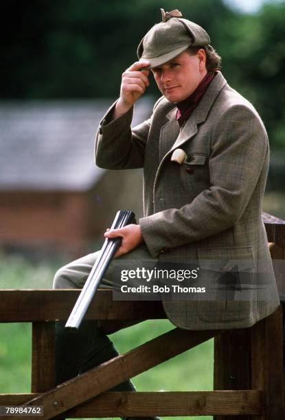 Sport, Football Feature, Humour, pic: September 1989, Tottenham Hotspur and England star Paul Gascoigne, dressed as a gamekeeper as he brandises a...