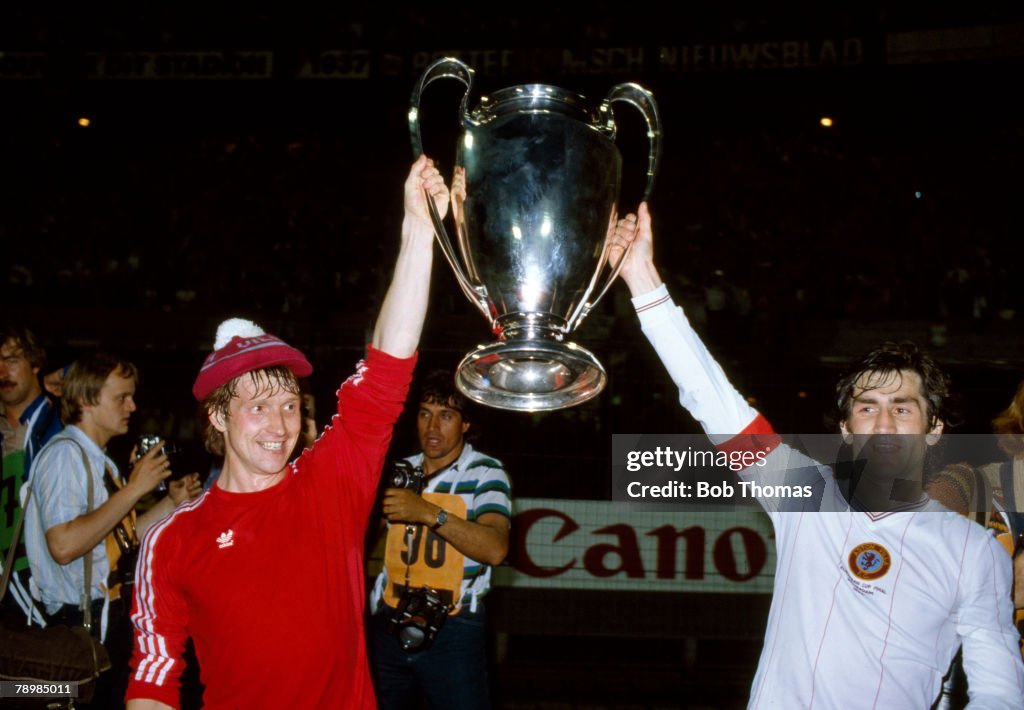 Sport. Football. pic: 26th May 1982. European Cup Final in Rotterdam. Aston Villa 1 v Bayern Munich 0. Aston Villa defender Kenny Swain left, and captain Dennis Mortimer parade the giant European Cup after the victory.