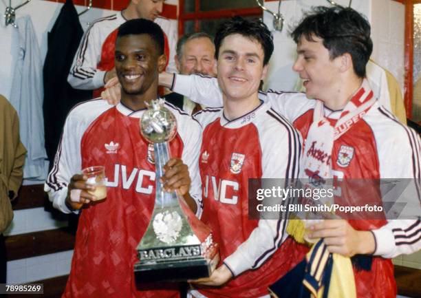 Arsenal players left-right Paul Davis, Anders Limpar and David Hillier during the "Gunners" celebrations to toast their League Championship success