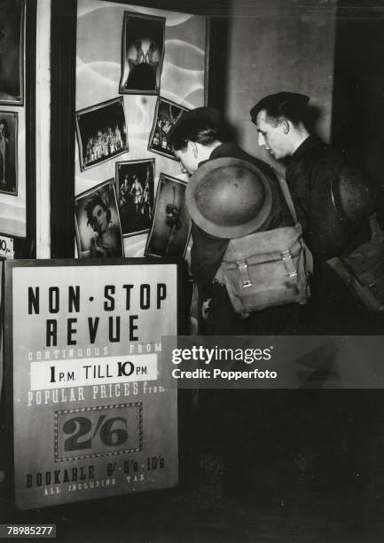 War and Conflict, World War Two, pic: 1939, Leisure / Britain, Two soldiers contemplating entry to the Prince of Wales Theatre in London, for the non...