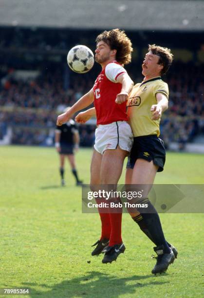 5th May 1986, Division 1, Oxford United 3 v Arsenal 0, Arsenal's Charlie Nicholas gets to a high ball ahead of Oxford United's Malcolm Shotton