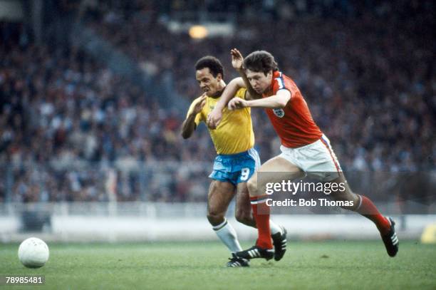 12th May 1981, Friendly International at Wembley, England 0 v Brazil 1, Brazil's Reinaldo in a race for the ball with England defender Alvin Martin