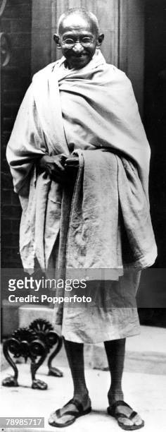 London, England, A picture of Indian political and spiritual leader and social reformer Mahatma Gandhi on the steps of 10 Downing Street on his visit...