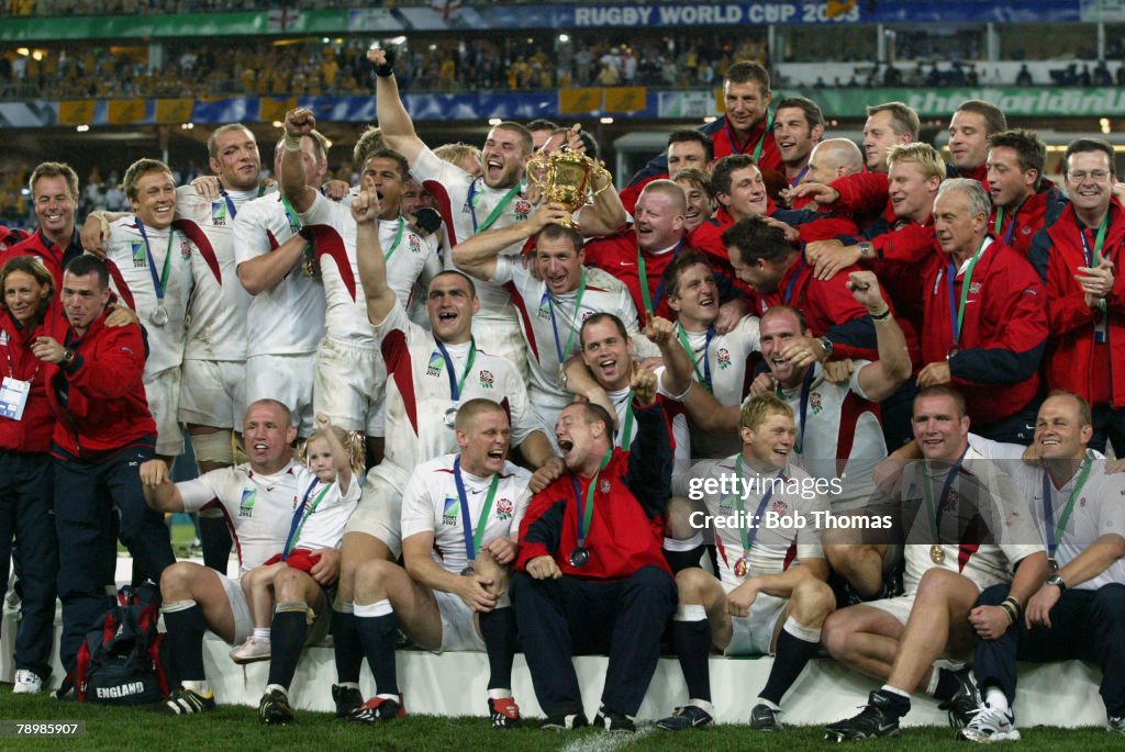 BT Sport. Rugby World Cup Final. Telstra Stadium. Sydney, Australia. 22nd November 2003. Australia 17 v England 20. The England team celebrate with the Webb Ellis trophy.