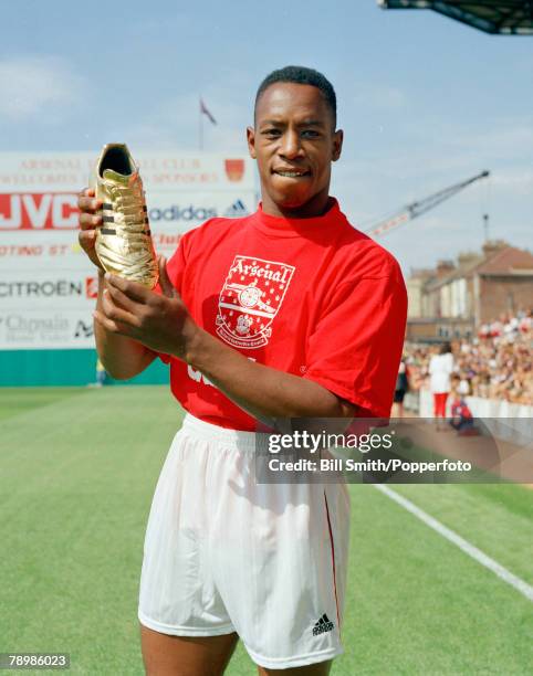 Arsenal striker Ian Wright proudly holds his Golden Shoe award for his 29 goals in season 1991-1992